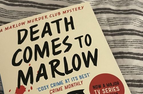 Death comes to Marlow book on a striped bed